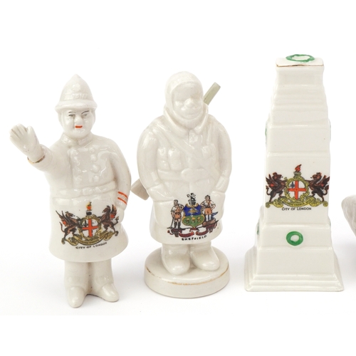 1260 - Seven military interest WWI crested china items comprising two figures, two tanks, a car, cannon and... 