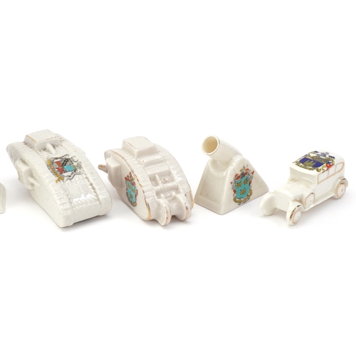 1260 - Seven military interest WWI crested china items comprising two figures, two tanks, a car, cannon and... 