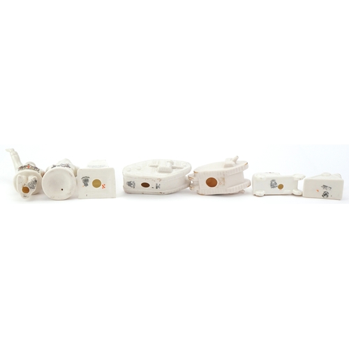1260 - Seven military interest WWI crested china items comprising two figures, two tanks, a car, cannon and... 