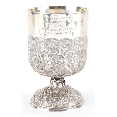Gurkha 6 rifles, a military interest Hong Kong silver goblet engraved Presented to Captain I S Gordon by His Fellow Officers 11th April 1969, the body embossed with fruiting vines, 12.5cm high, 340.2g.