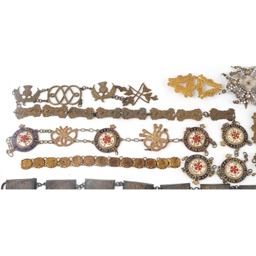 1285 - A large collection of military interest badges and belt buckles.