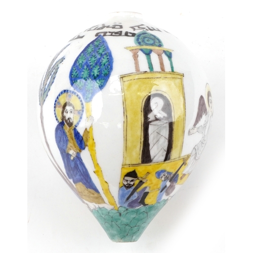 57 - A Turkish Ottoman Kutahya hanging ball hand painted with biblical figures, 20cm high.