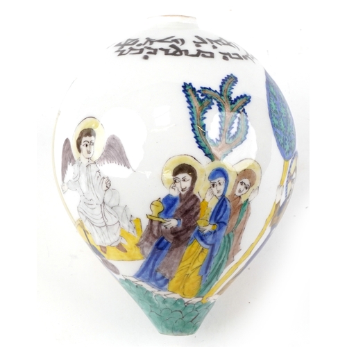 57 - A Turkish Ottoman Kutahya hanging ball hand painted with biblical figures, 20cm high.