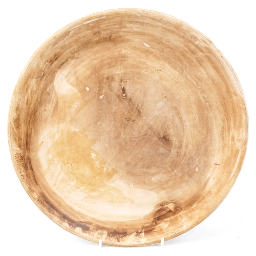 51 - An Islamic turquoise pottery mosque plaque, 33.5cm in diameter.