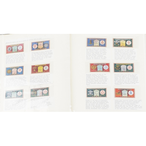 1304 - A large collection of military interest cigarette cards, some silk, arranged in three albums and Pap... 