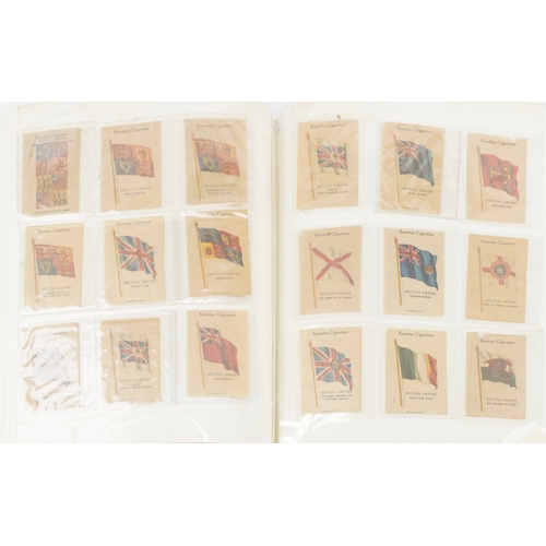 1304 - A large collection of military interest cigarette cards, some silk, arranged in three albums and Pap... 