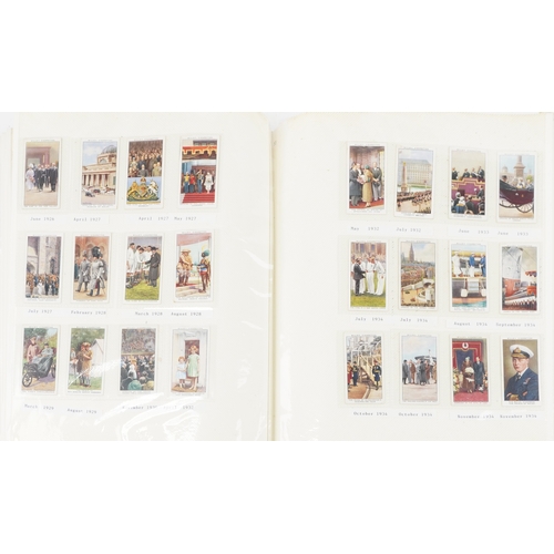 1304 - A large collection of military interest cigarette cards, some silk, arranged in three albums and Pap... 