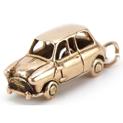 A 9ct gold charm in the form of a Mini car, 2.3cm wide, 3.9g.