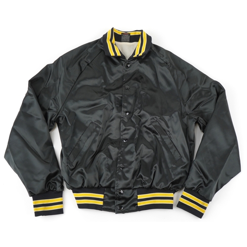 559 - The Executioner's Song (1982), a black crew jacket with white printed back and yellow striped cuffs,... 