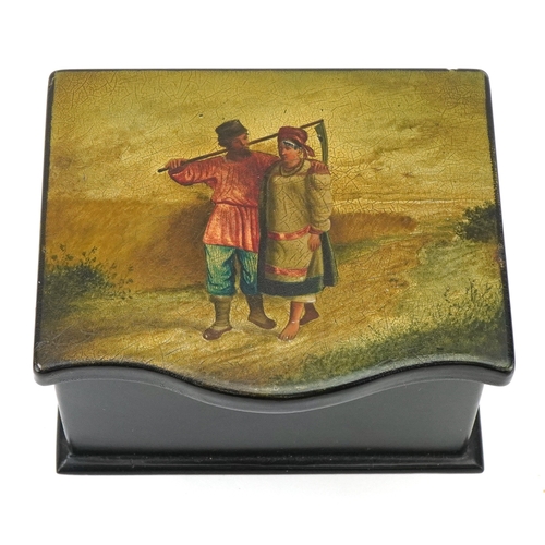 60 - An early 20th century Russian papier mâché and lacquer box, the hinged lid hand painted with a peasa... 