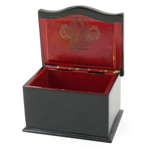 60 - An early 20th century Russian papier mâché and lacquer box, the hinged lid hand painted with a peasa... 