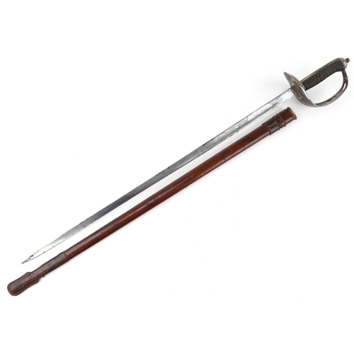 1308 - A British military World War I sword and scabbard with wire bound shagreen grip, the steel blade eng... 