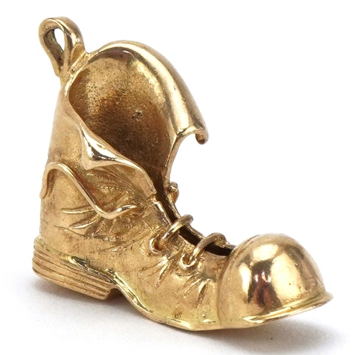 A 9ct gold charm in the form of a boot, 2.6cm in length, 5.9g.