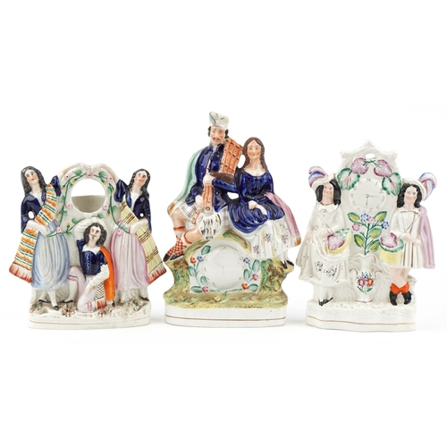 85 - A group of three Victorian Staffordshire Pottery flatbacks, the largest 34cm high.
