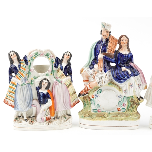 85 - A group of three Victorian Staffordshire Pottery flatbacks, the largest 34cm high.
