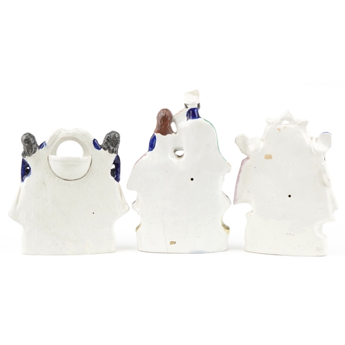 85 - A group of three Victorian Staffordshire Pottery flatbacks, the largest 34cm high.