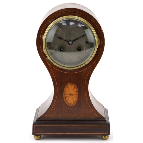 144 - An Edwardian inlaid mahogany balloon cased mantle clock having silvered dial with Roman numerals, st... 