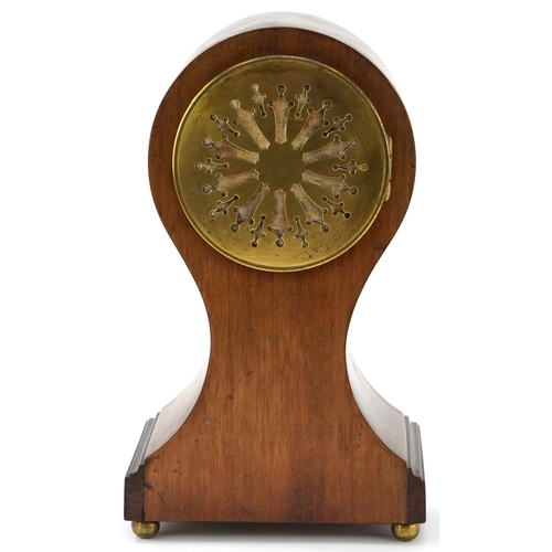 144 - An Edwardian inlaid mahogany balloon cased mantle clock having silvered dial with Roman numerals, st... 