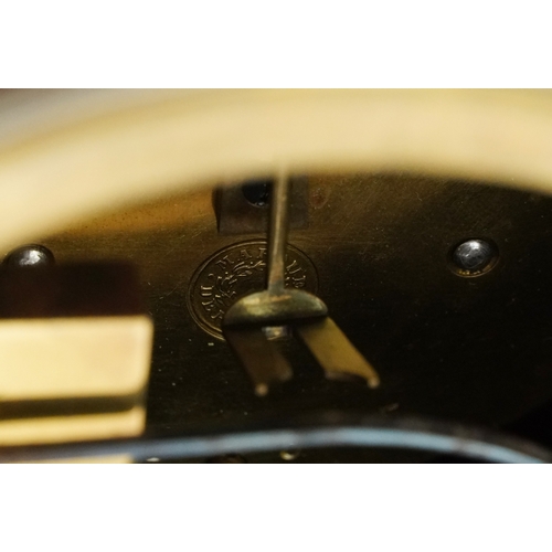 144 - An Edwardian inlaid mahogany balloon cased mantle clock having silvered dial with Roman numerals, st... 