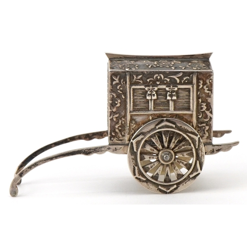 65 - A novelty Japanese sterling silver caster in the form of a rickshaw with rotating wheels, 6.5cm in l... 