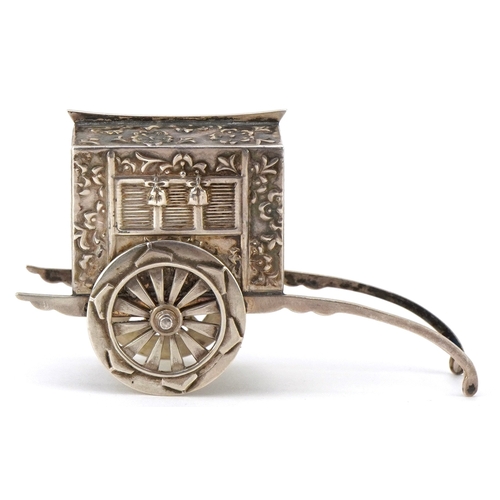 65 - A novelty Japanese sterling silver caster in the form of a rickshaw with rotating wheels, 6.5cm in l... 
