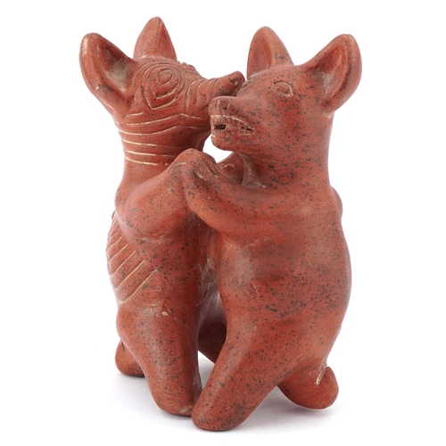 466 - A terracotta figure group of Colima dogs, 20cm high.
