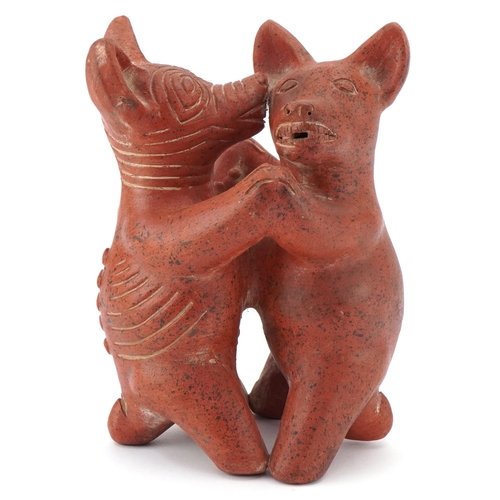 466 - A terracotta figure group of Colima dogs, 20cm high.
