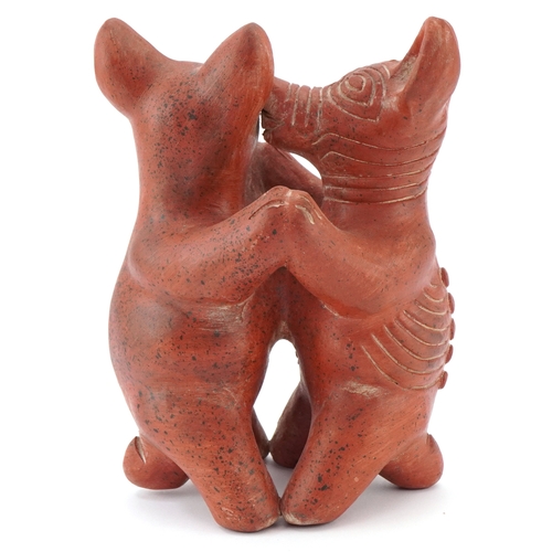 466 - A terracotta figure group of Colima dogs, 20cm high.