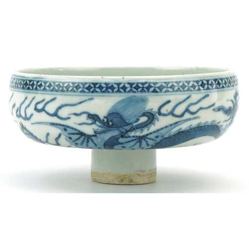 114 - A Chinese blue and white porcelain stem bowl hand painted with dragons, character marks to the inter... 