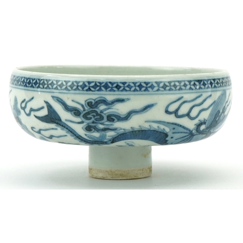 114 - A Chinese blue and white porcelain stem bowl hand painted with dragons, character marks to the inter... 