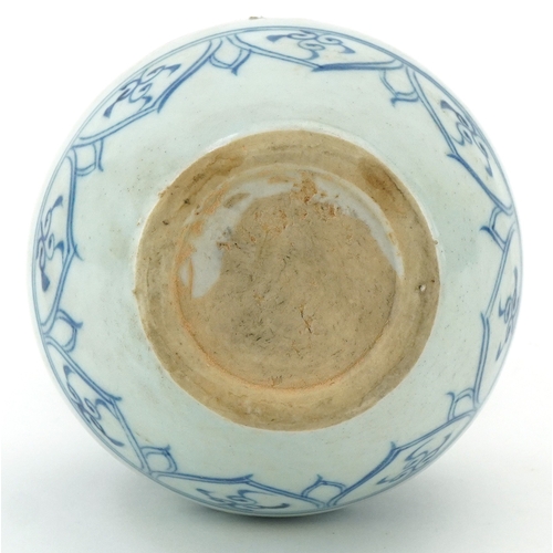 115 - A Chinese blue and white porcelain double gourd vase hand painted with scrolling foliage, 21cm high.