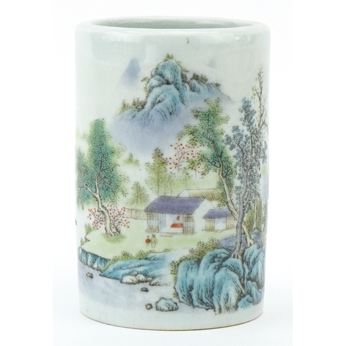 116 - A Chinese porcelain brush pot decorated with mountainous scenery and inscriptions, 11.5cm high.