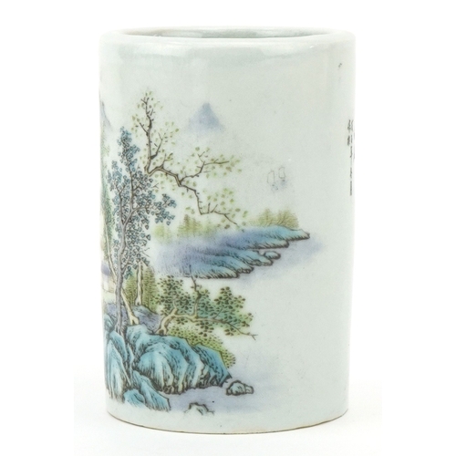 116 - A Chinese porcelain brush pot decorated with mountainous scenery and inscriptions, 11.5cm high.