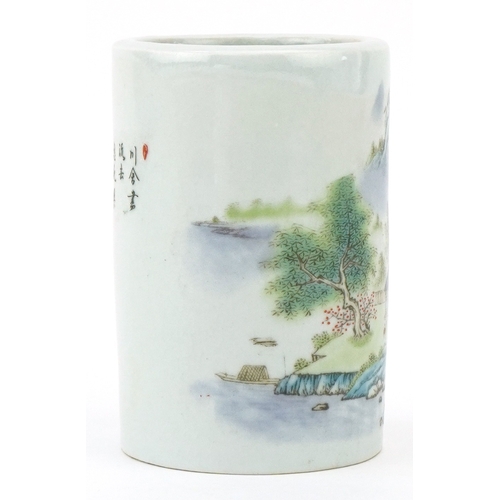 116 - A Chinese porcelain brush pot decorated with mountainous scenery and inscriptions, 11.5cm high.