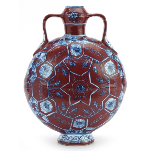 112 - A Chinese porcelain twin handled moon flask hand painted with floral decoration, 31cm high.