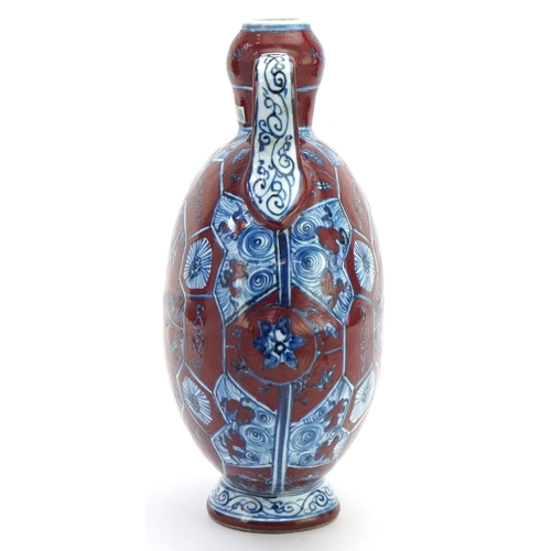 112 - A Chinese porcelain twin handled moon flask hand painted with floral decoration, 31cm high.