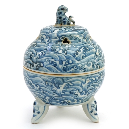111 - A Chinese blue and white porcelain tripod incense bowl and cover hand painted with masks, crashing w... 