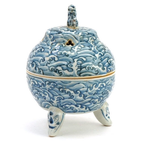 111 - A Chinese blue and white porcelain tripod incense bowl and cover hand painted with masks, crashing w... 