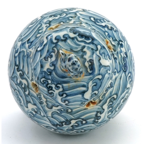 111 - A Chinese blue and white porcelain tripod incense bowl and cover hand painted with masks, crashing w... 