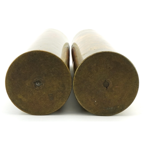 A pair of military interest World War I shell cases inscribed Fired by ...
