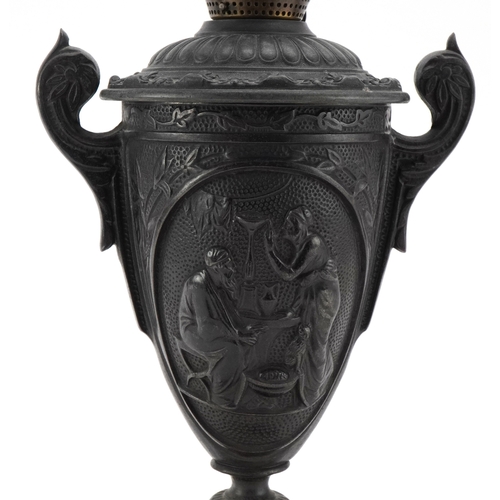 76 - A Grand Tour design cast iron oil lamp base cast with classical figures, foundry mark to the base, 2... 