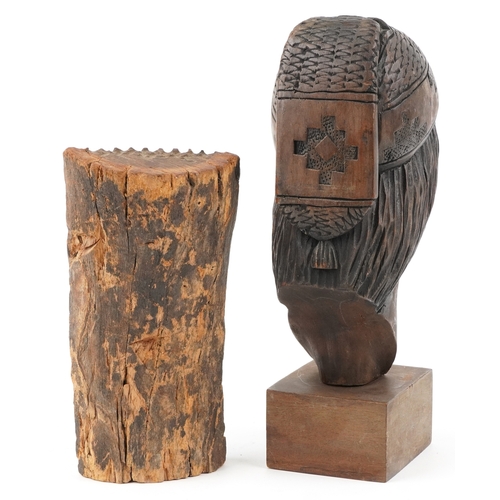 468 - Two softwood sculptures comprising a Native American male head signed by Armaza and an African carve... 