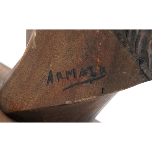468 - Two softwood sculptures comprising a Native American male head signed by Armaza and an African carve... 
