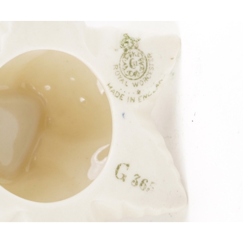 92 - Royal Worcester, collectable porcelain comprising a hand painted floral blush ivory bottleneck vase ... 