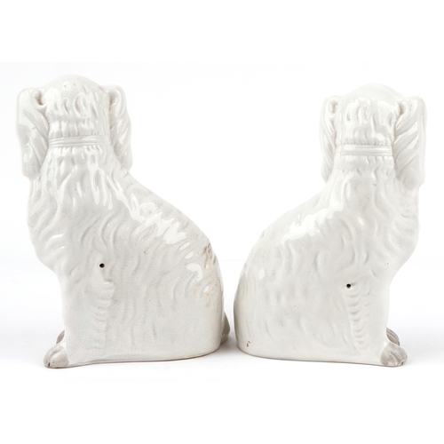 88 - A pair of early 20th century Staffordshire pottery Spaniels, 25cm high.