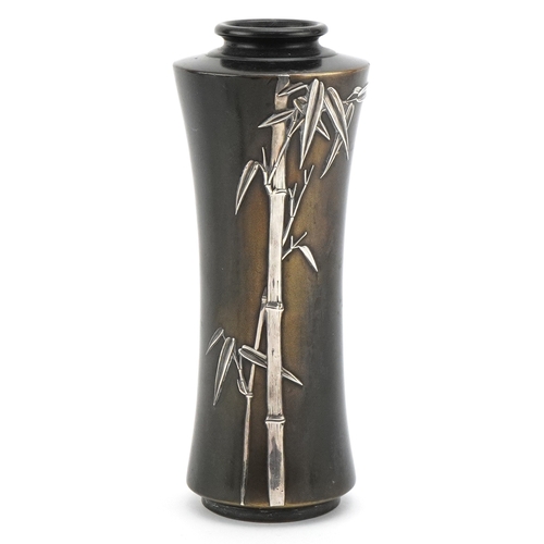 63 - A Japanese silver overlaid bronze vase decorated with bamboo grove, 17.5cm high.