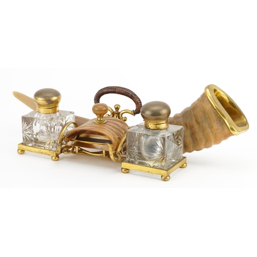 101 - Edwardian gilt brass and horn desk stand with two glass inkwells engraved To the indefatigable and e... 