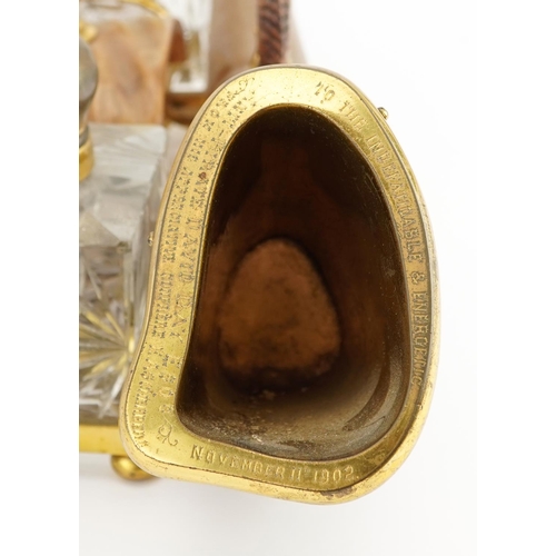 101 - Edwardian gilt brass and horn desk stand with two glass inkwells engraved To the indefatigable and e... 