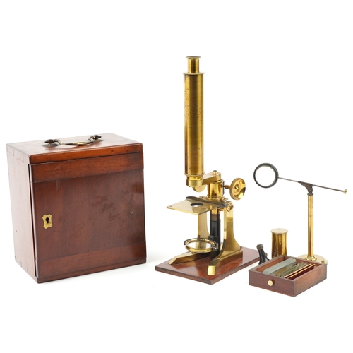 518 - A 19th century brass microscope with fitted case by W J Salmon, London, the case 21cm high.