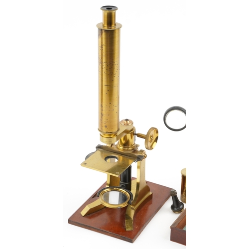 518 - A 19th century brass microscope with fitted case by W J Salmon, London, the case 21cm high.